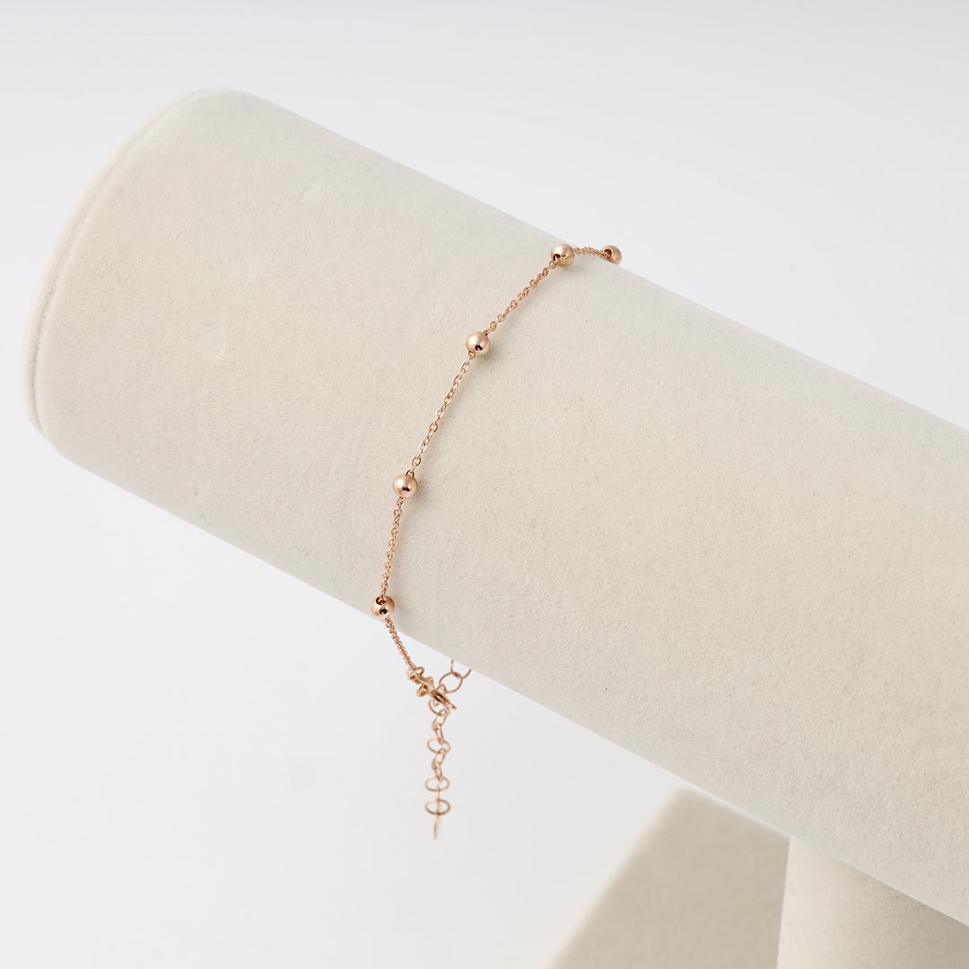 Delicate 14k gold bead chain bracelet on display stand, minimalist Ukrainian Jewelry for women, dainty gold bracelet gift.