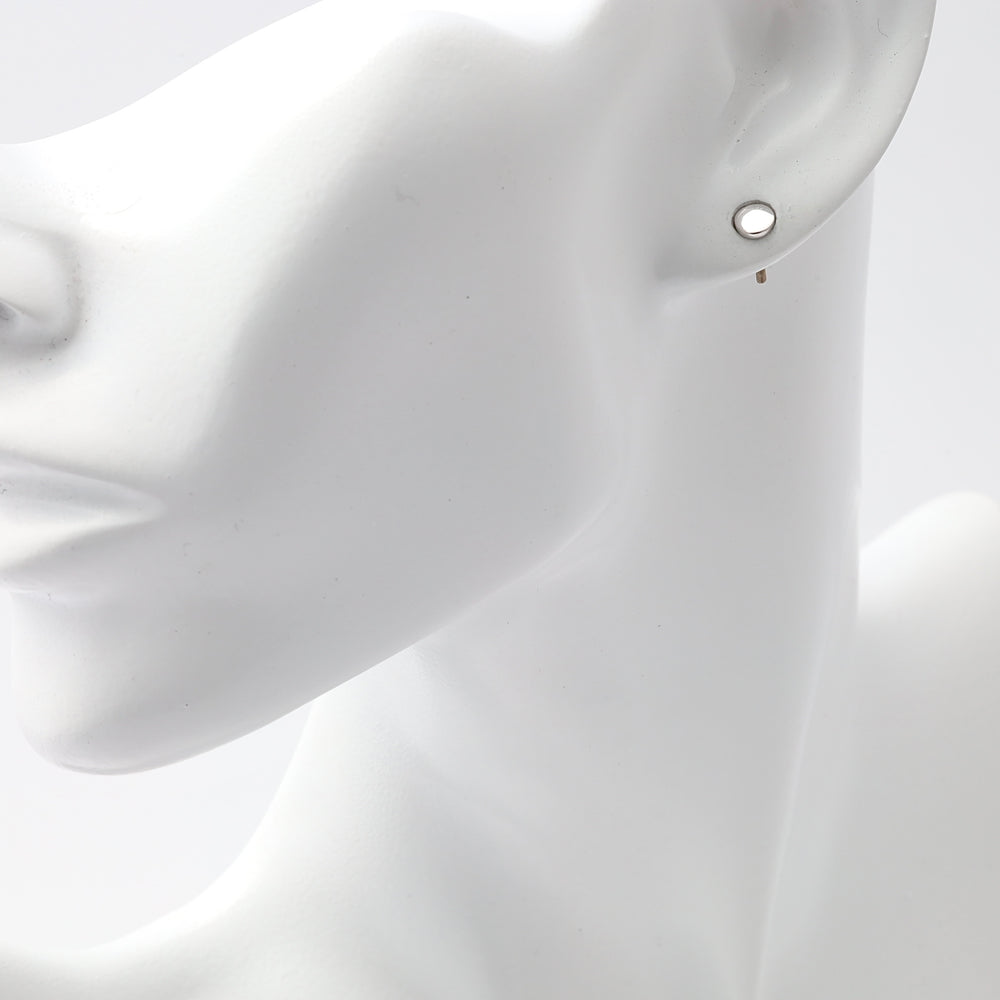 Single sterling silver open circle stud earring on mannequin ear, minimalist Ukrainian Jewelry, silver stud earrings for women.