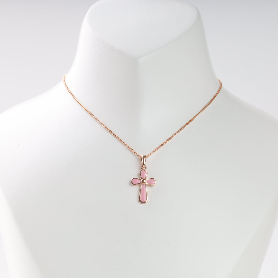 Rose gold necklace with pink enamel cross pendant displayed on a white bust for jewelry, cross necklace, enamel pendant.