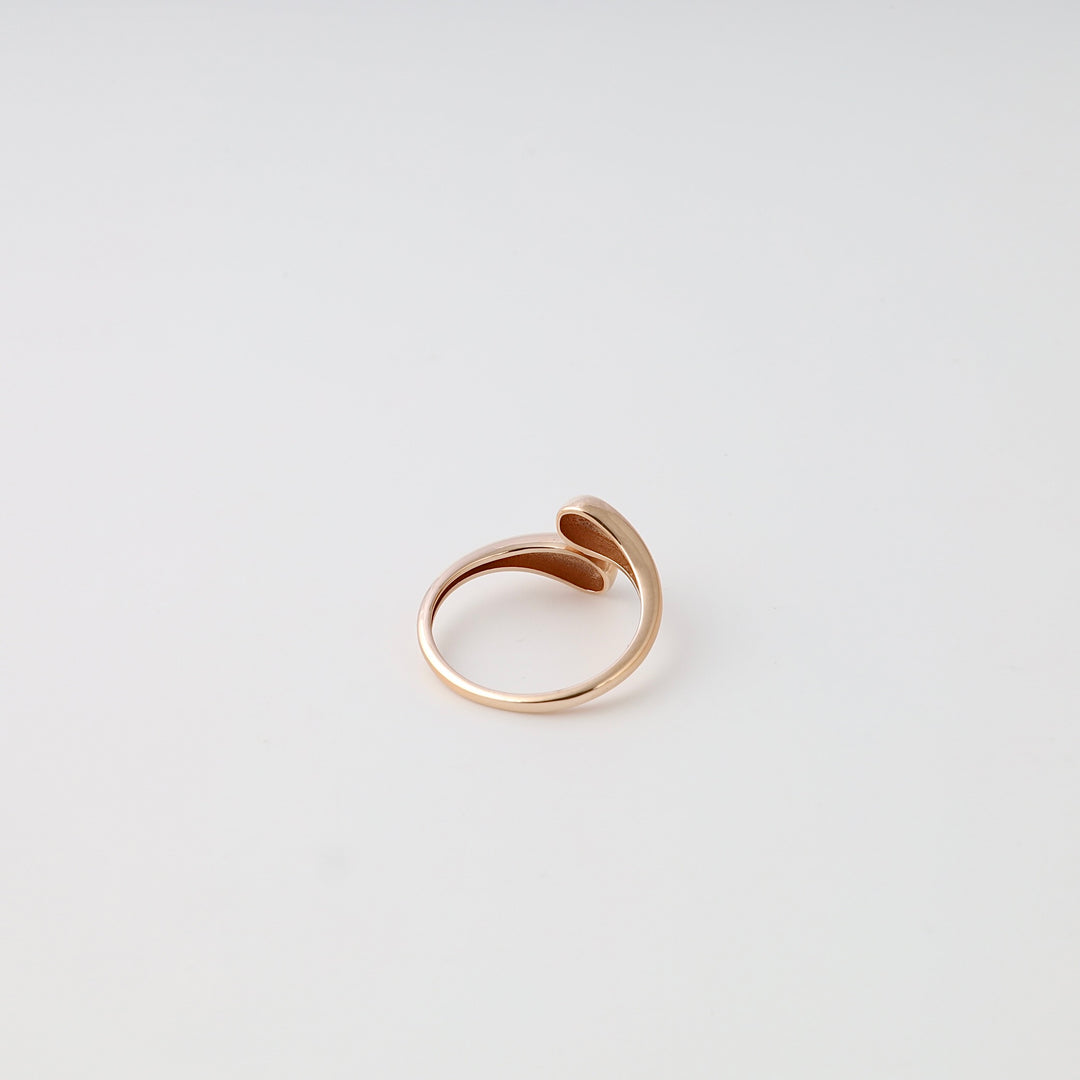 Minimalist 14k gold wrap ring on white background, modern open band Ukrainian Jewelry for women, gold statement ring.
