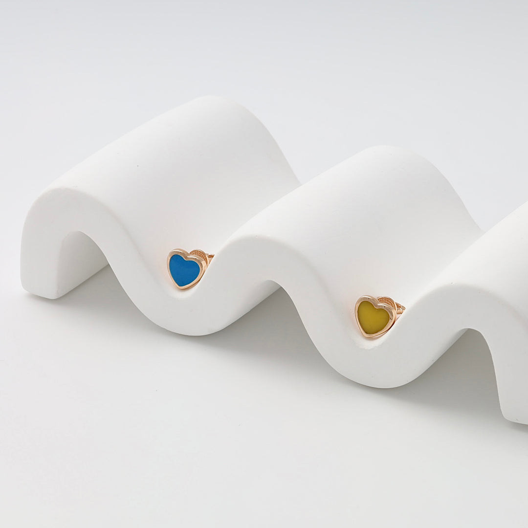 Gold heart enamel stud earrings in blue and yellow displayed on white stand, Ukrainian Jewelry, cute gold heart earrings gift.