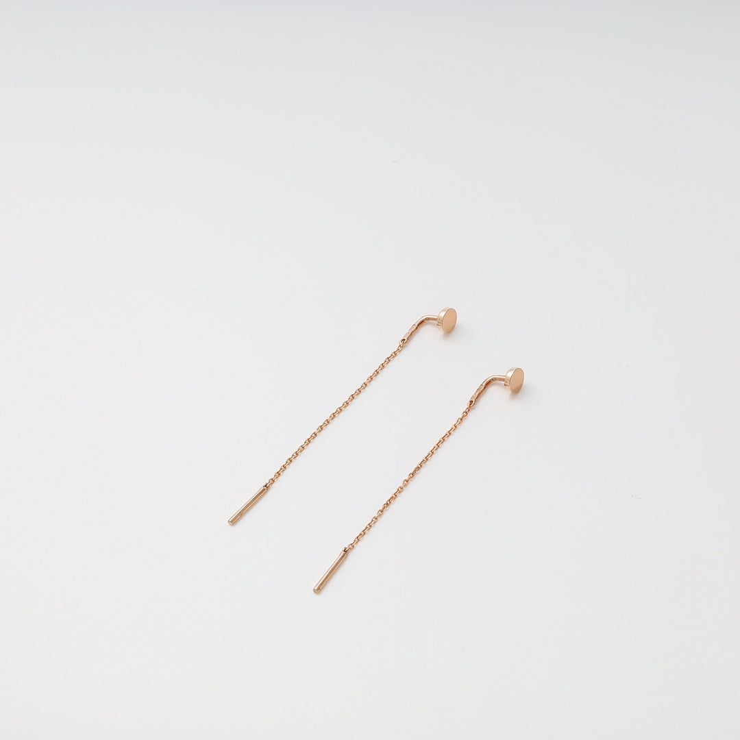 Pair of rose gold chain threader earrings with bar ends displayed on a white background.