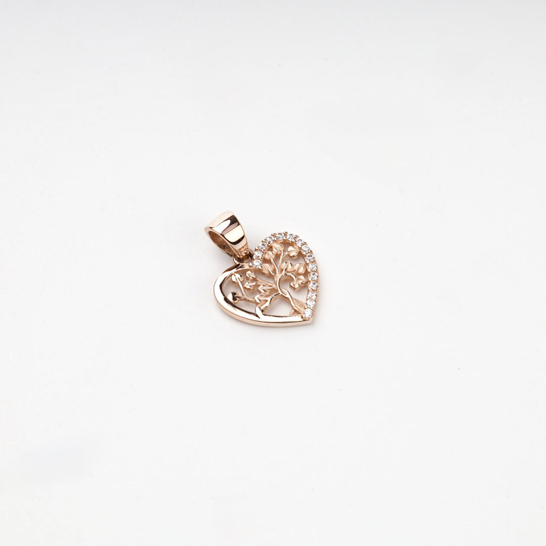 Rose gold heart pendant with openwork tree of life and cubic zirconia, angled view