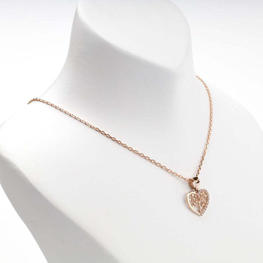 Openwork rose gold heart pendant with cubic zirconia, overhead view