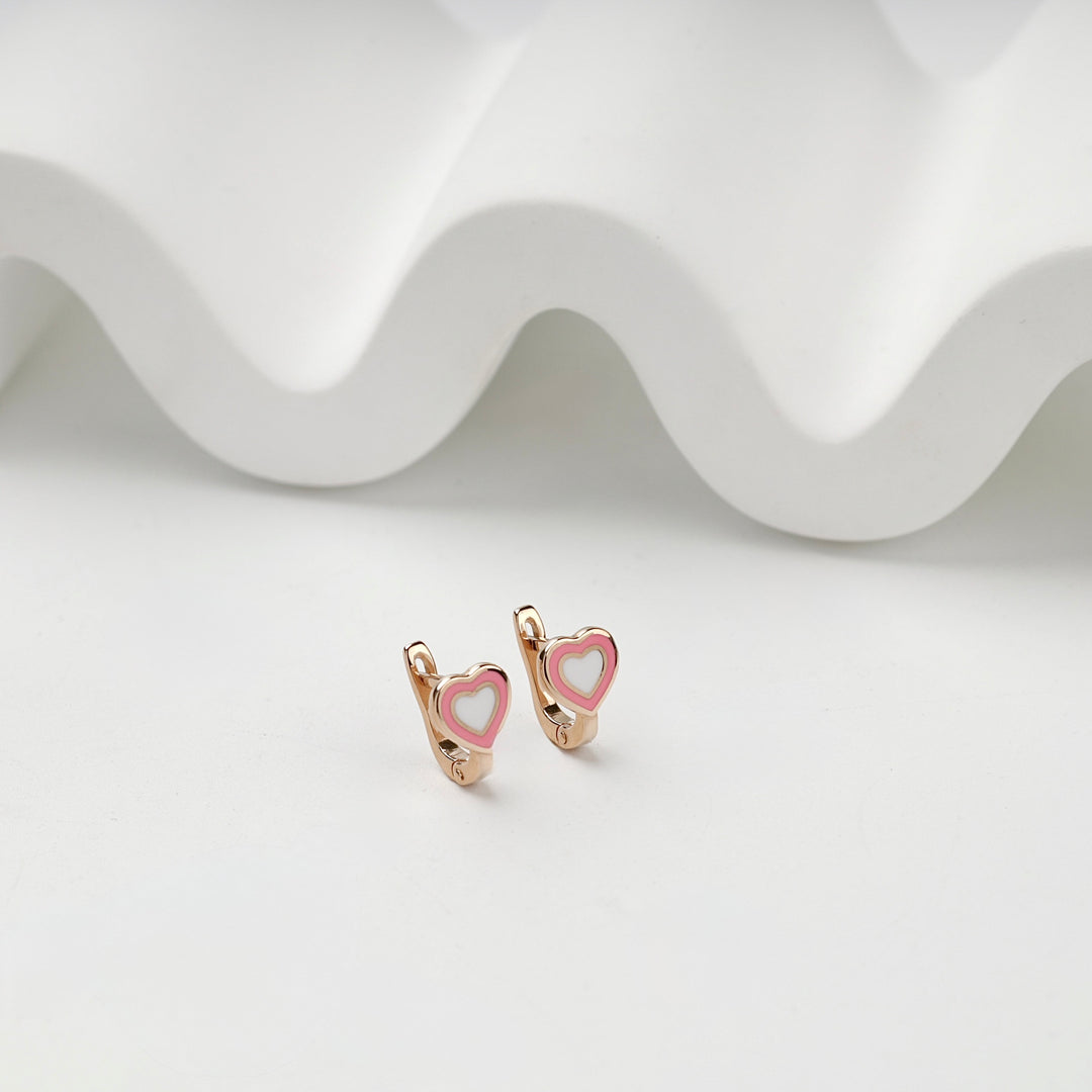Front view of matching heart earrings in polished rose gold