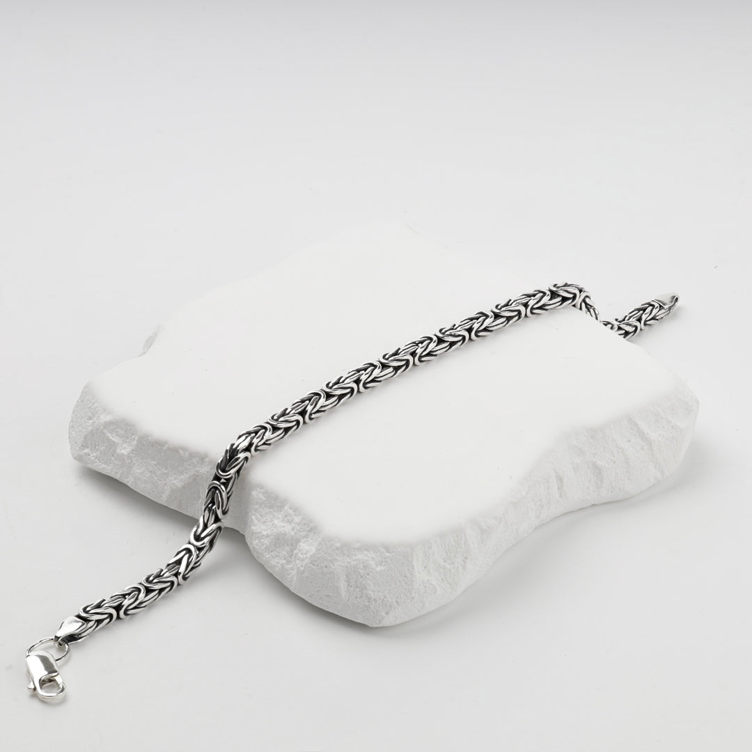 Silver Byzantine weave bracelet coiled, close view