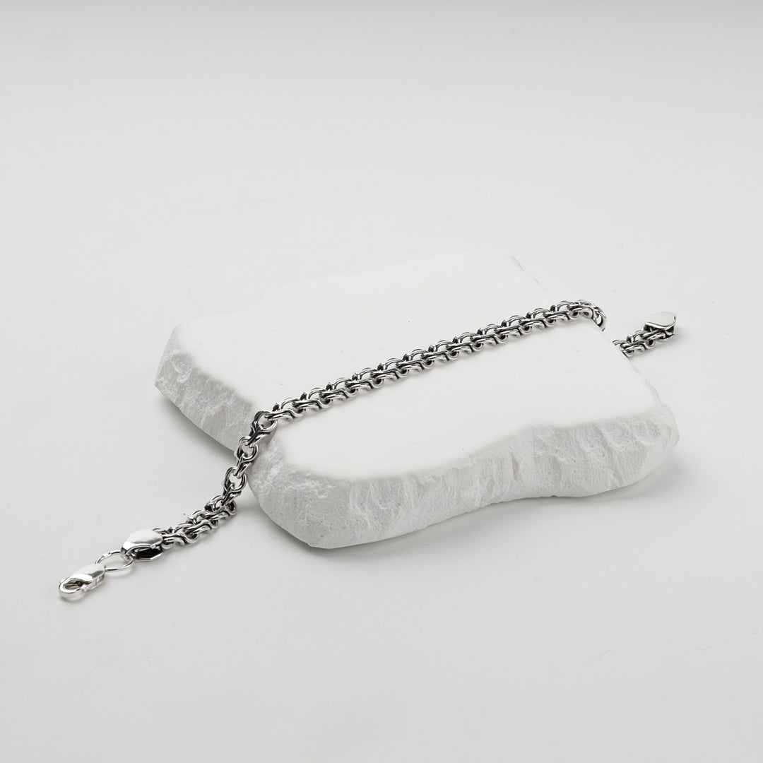 Silver Bismarck weave bracelet coiled, close view