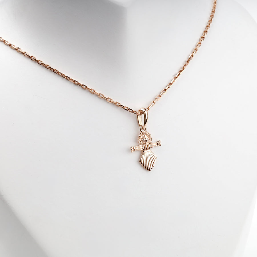 Rose gold motanka pendant, detail of the floral crown and arms