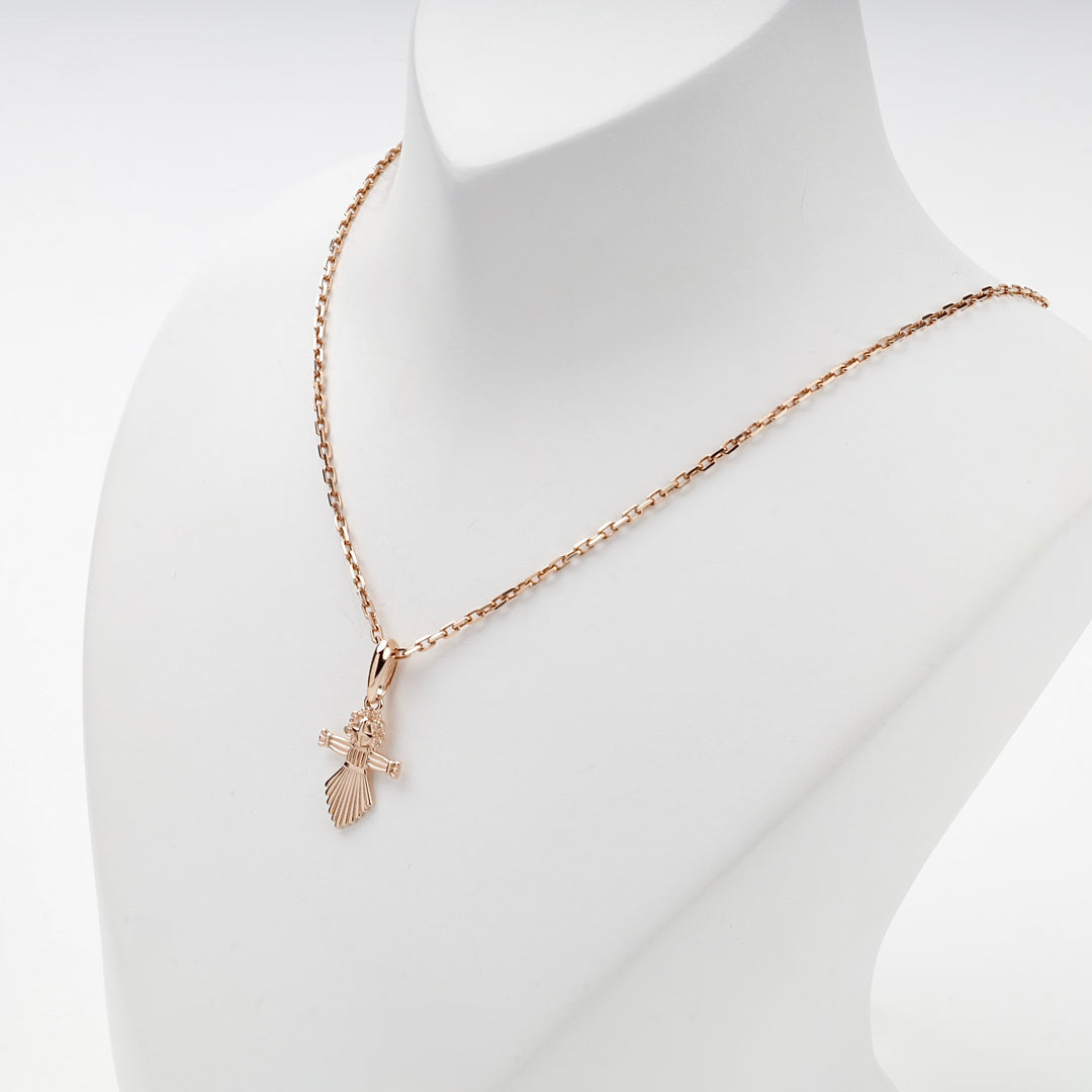 Ukrainian motanka doll pendant in rose gold, close view