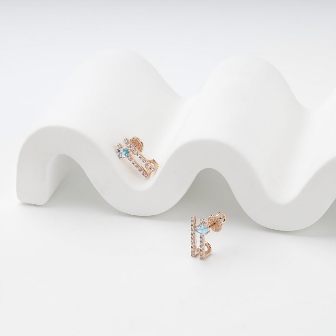 Geometric Stud Earrings with Blue Topaz | 14K Rose Gold (585) — angled view