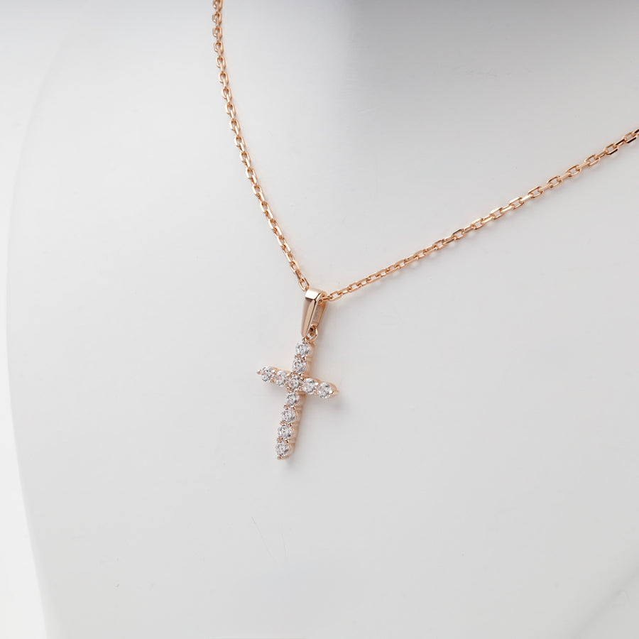 Rose gold cross pendant set with cubic zirconia, detail