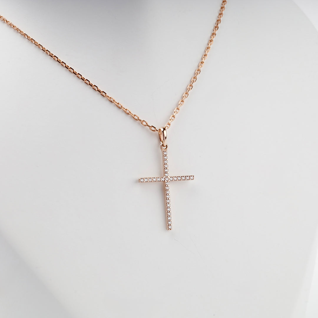 Elongated 14K rose gold CZ cross pendant, close view