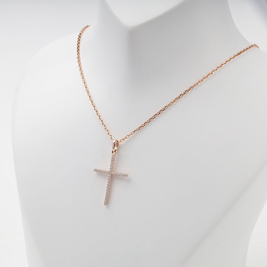 Long thin rose gold cross pendant set with cubic zirconia, detail
