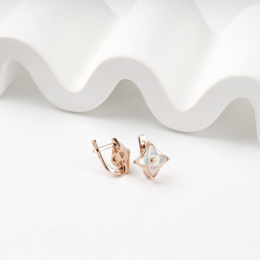Rose gold star earrings lifestyle photo