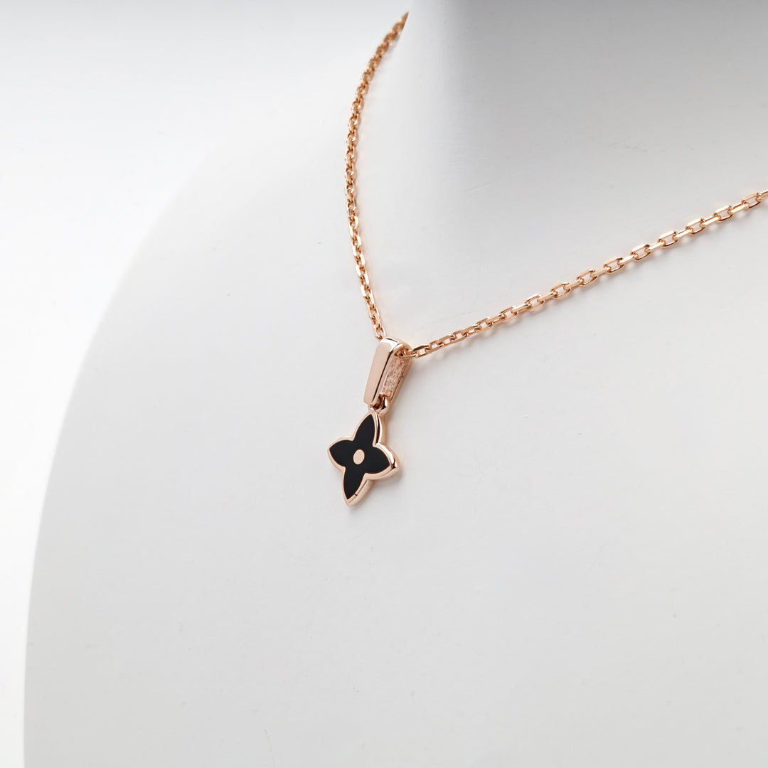 Rose gold black flower pendant detail