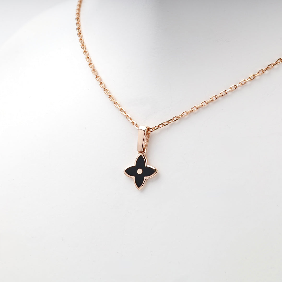 Rose gold black enamel pendant lifestyle photo