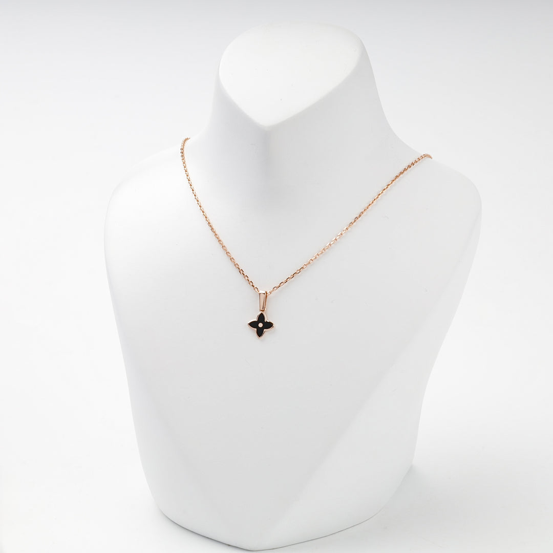 Rose gold black enamel flower pendant front view