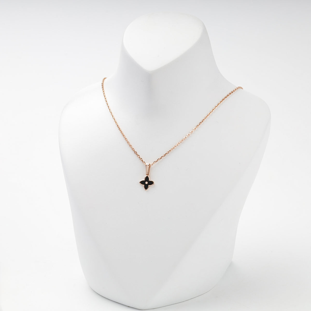 Rose gold black enamel flower pendant front view