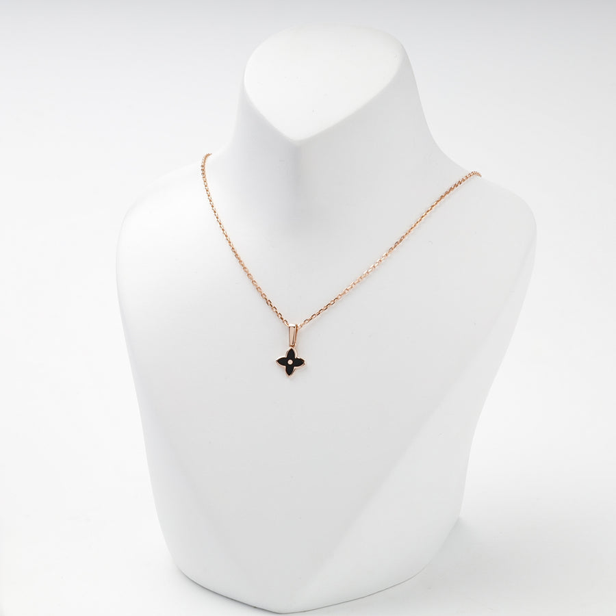 Rose gold black enamel flower pendant front view