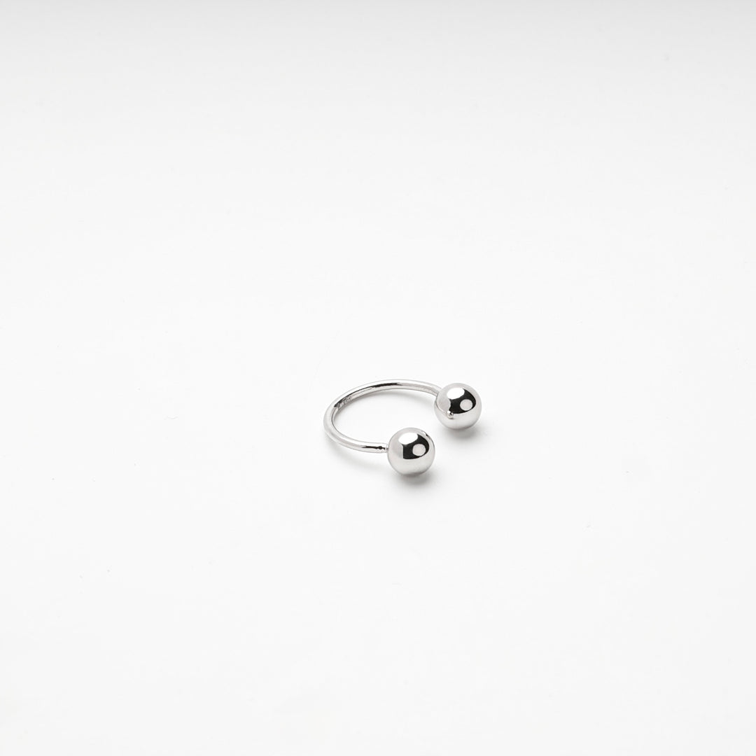 Angled view of the silver 925 double ball ring on a white background