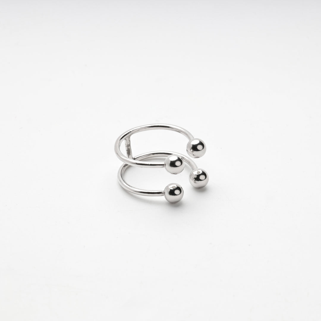 Side view of the silver 925 ring with its four polished ball ends