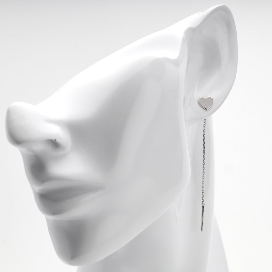 Silver 925 heart threader earring shown on a white mannequin ear