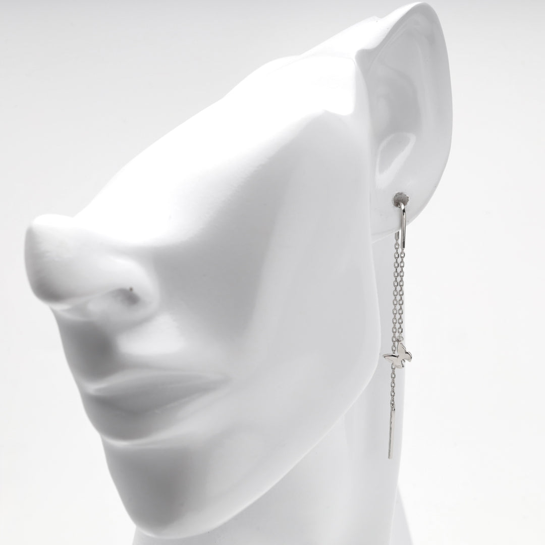 Profile view of the silver 925 butterfly threader earring on a mannequin