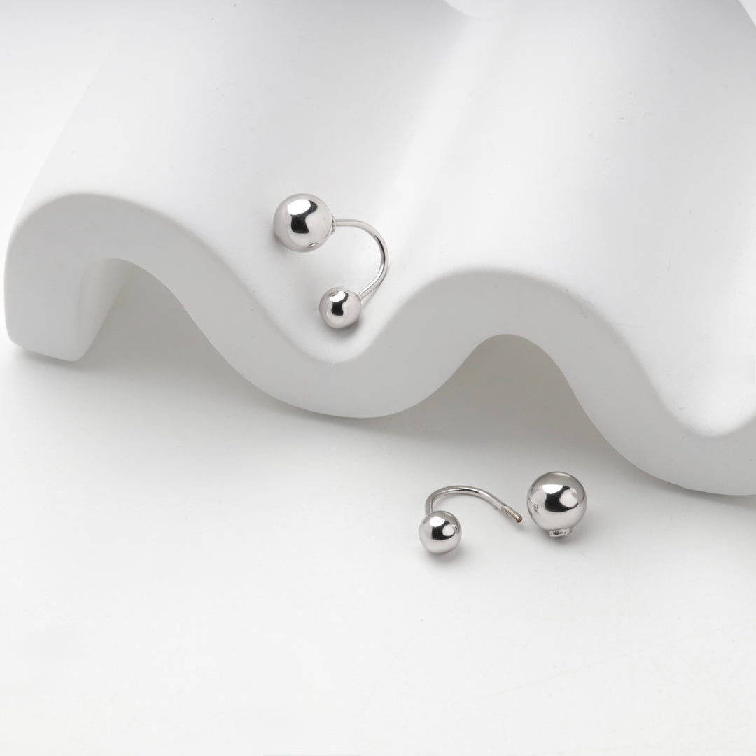 Close view of the large and small polished balls on the silver 925 earring