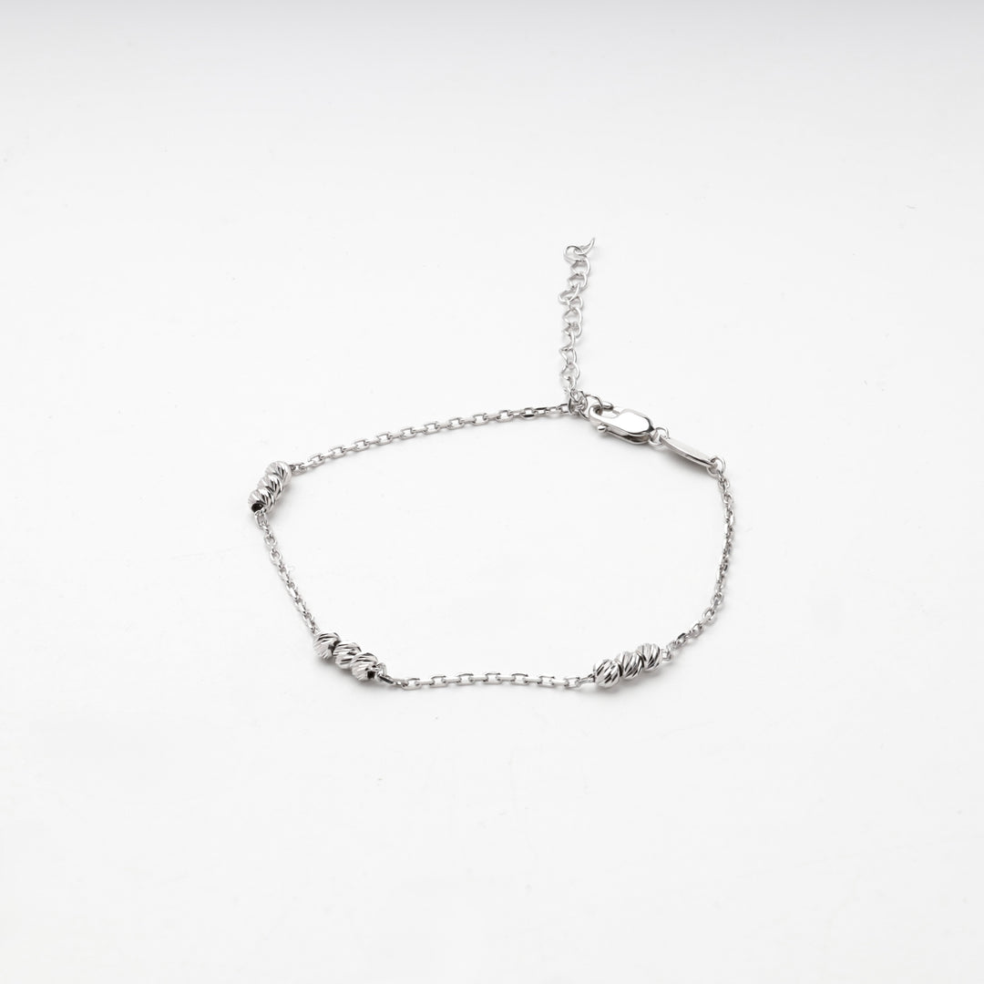 Silver 925 beaded bracelet laid flat with lobster clasp and extender chain