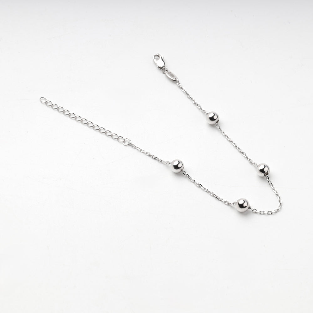 Sterling silver 925 bracelet with four round balls along an anchor chain
