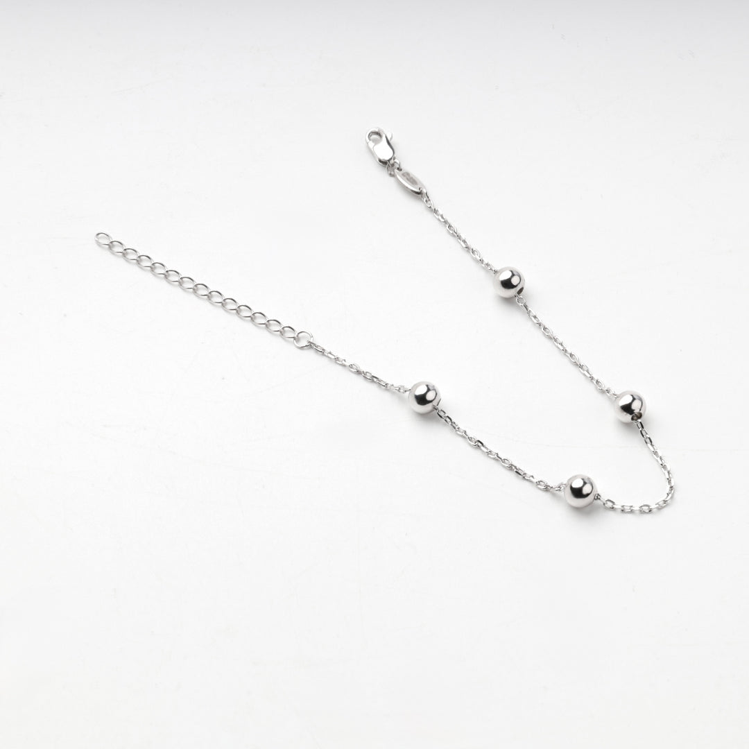 Sterling silver 925 bracelet with four round balls along an anchor chain