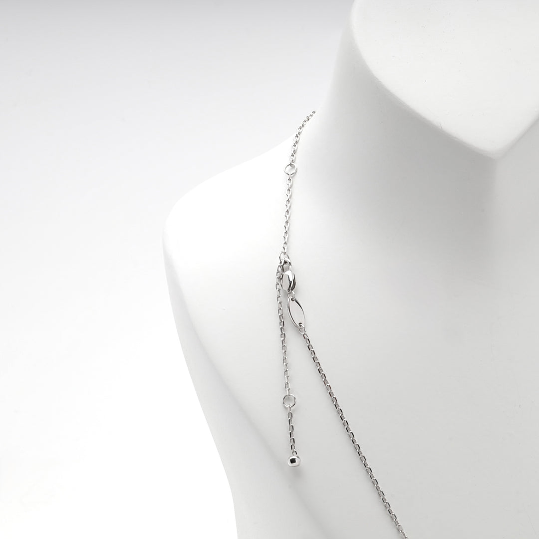 Silver 925 adjustable ball drop necklace with its sliding bead on a white bust