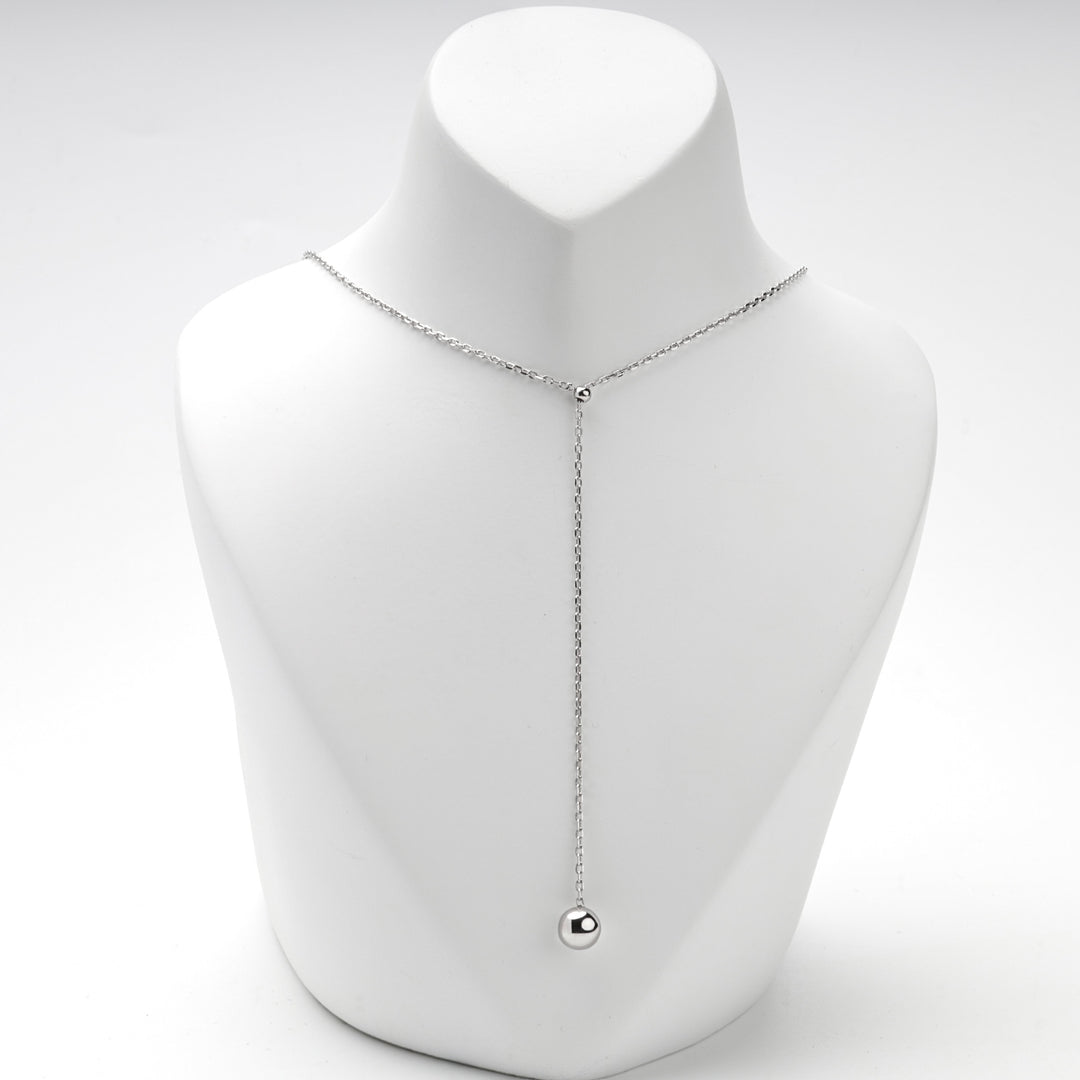 Silver chain necklace forming a V with the ball at the end of the drop