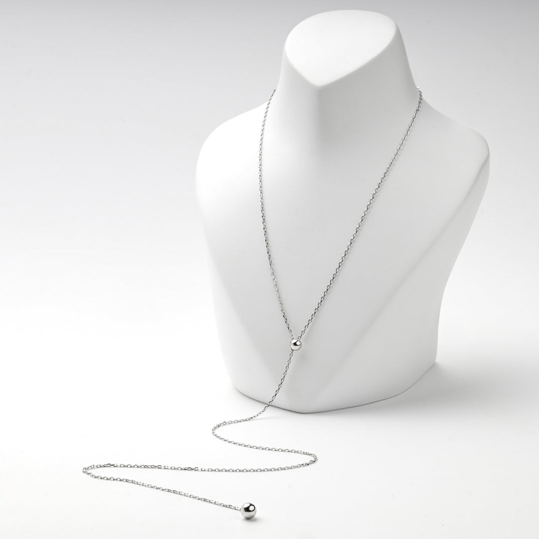 Full length of the silver 925 Y necklace on a display bust