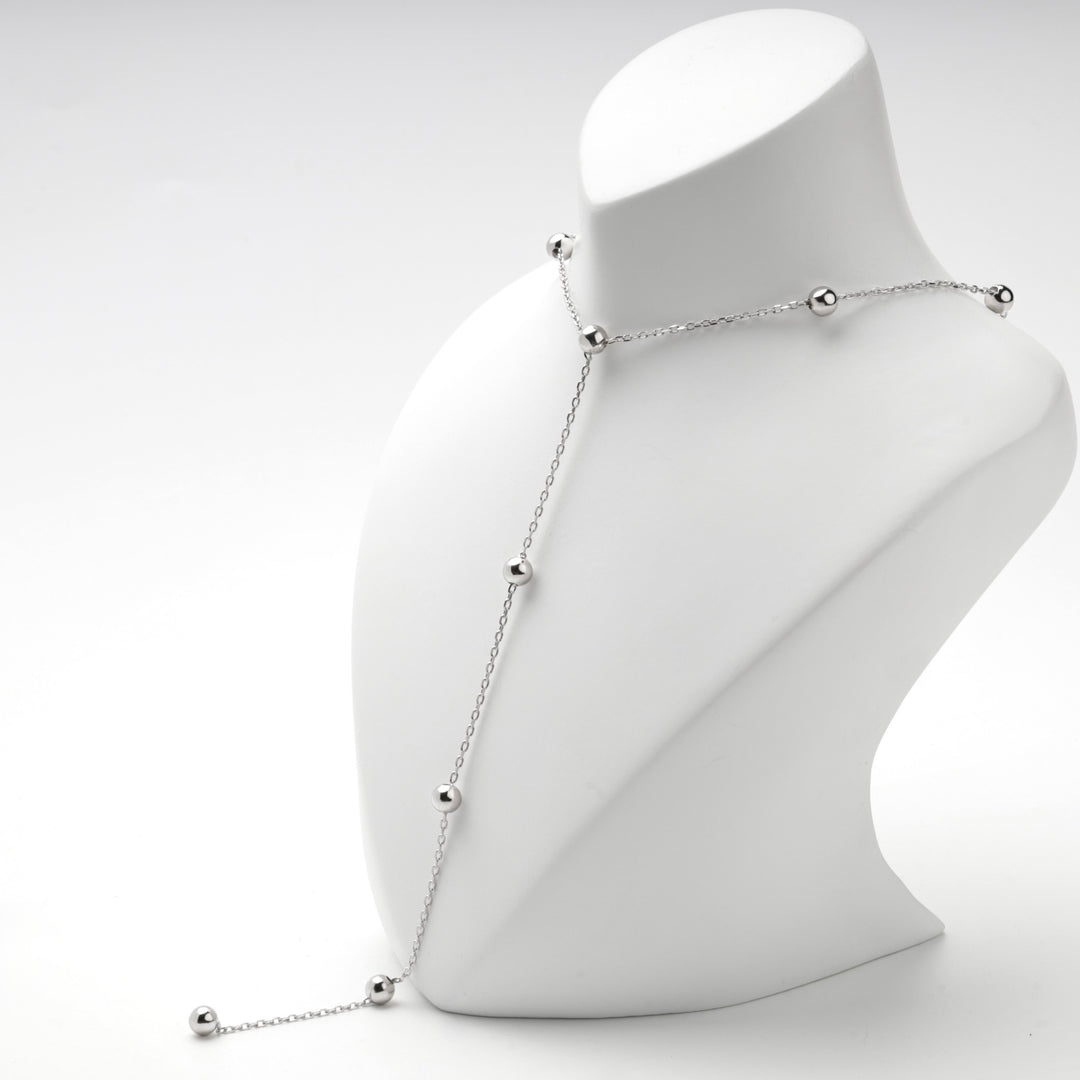 Silver 925 beaded Y necklace on a white display bust