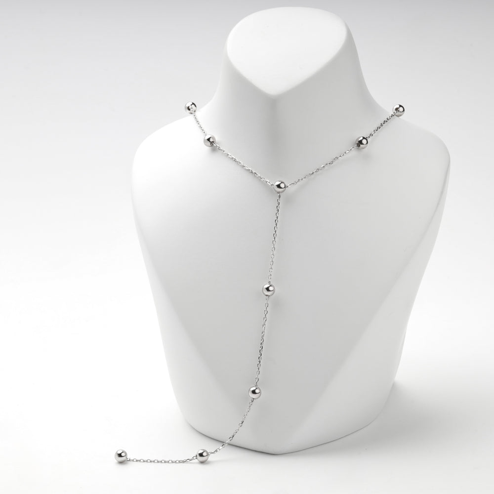 Close view of the bead stations on the silver 925 Y necklace