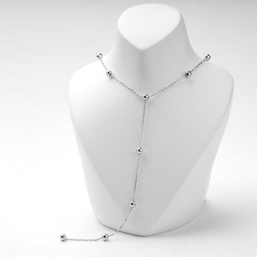 Close view of the bead stations on the silver 925 Y necklace