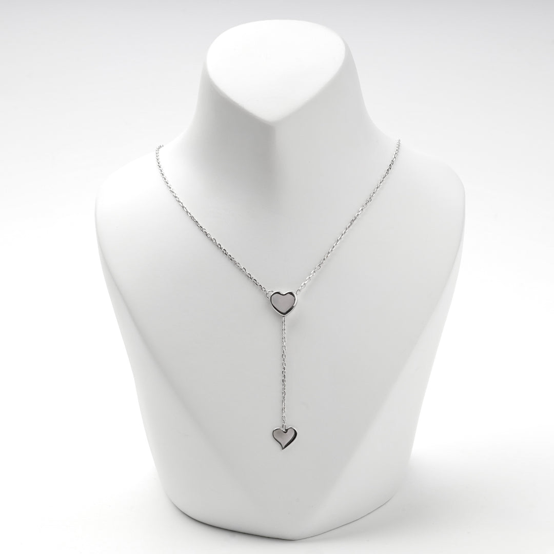 Silver 925 Y necklace with two flat hearts on a white display bust
