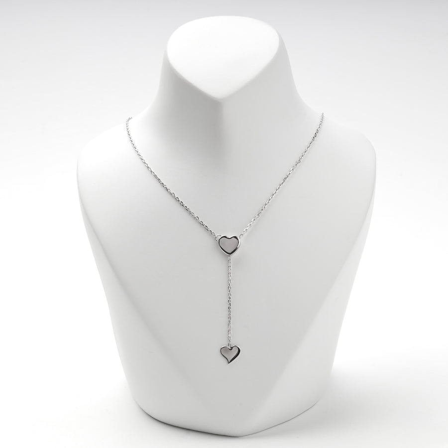 Silver 925 Y necklace with two flat hearts on a white display bust