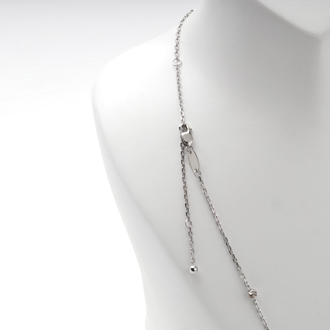 Silver 925 beaded station chain necklace with its adjustable extender on a display bust