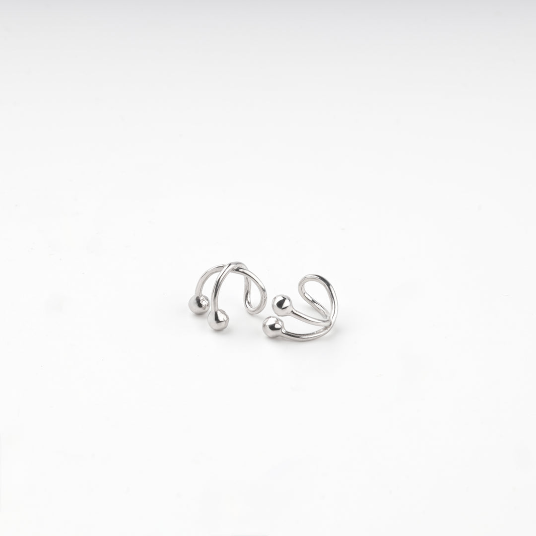 Pair of silver 925 crossover ear cuffs with polished ball ends
