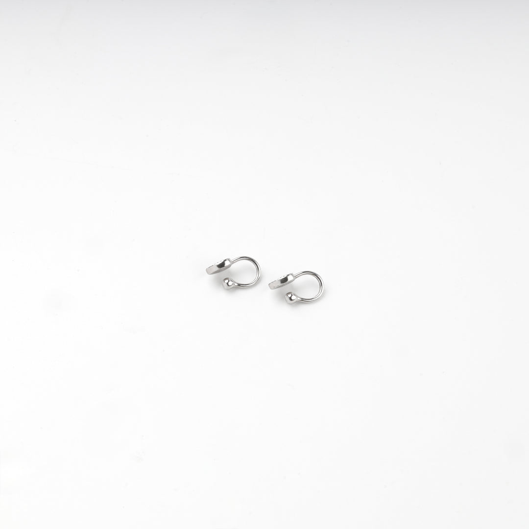 Both silver 925 black heart earrings shown side by side