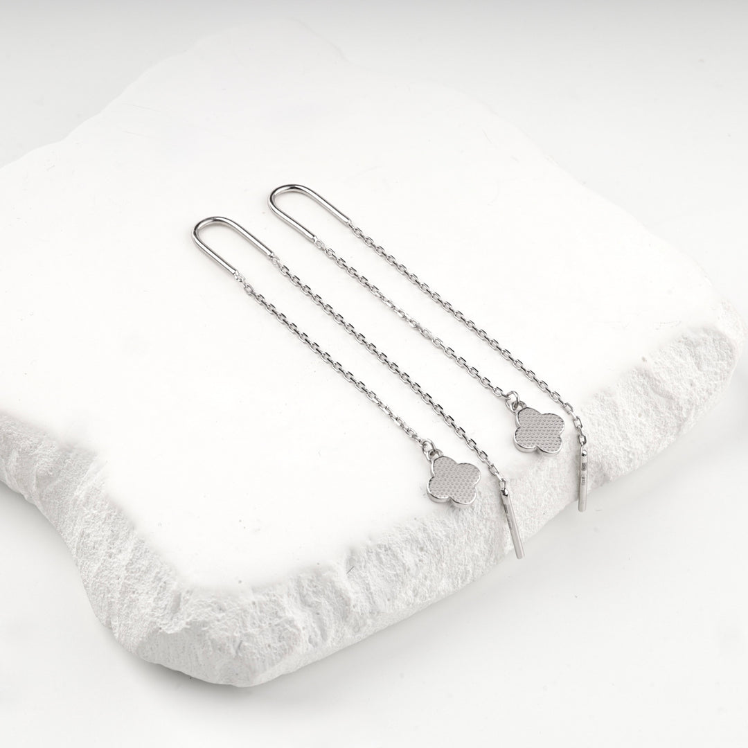 Sterling silver 925 threader earrings showing the patterned reverse of the clover charms