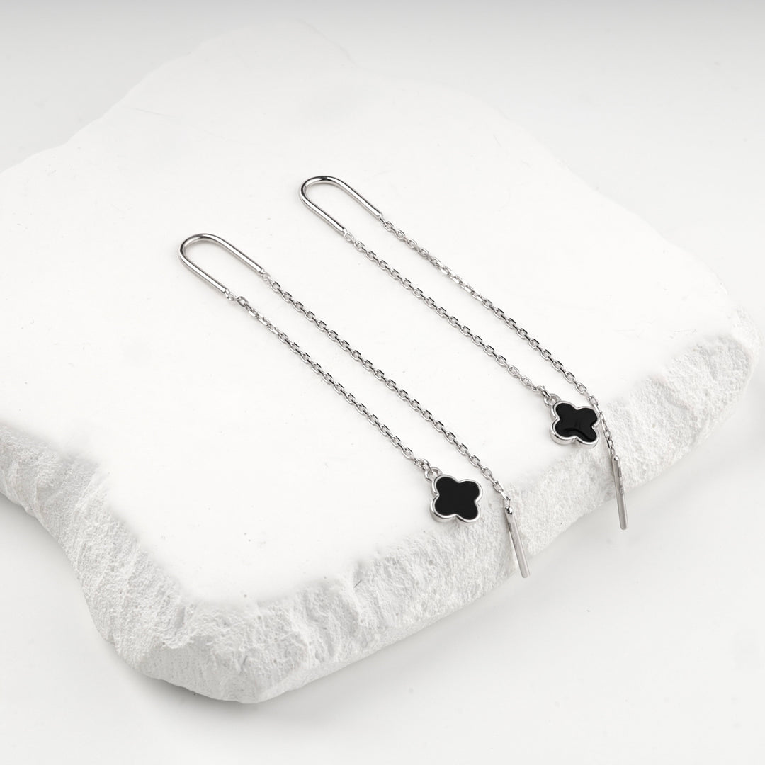 Silver 925 threader earrings laid out with their long ear wires and chains