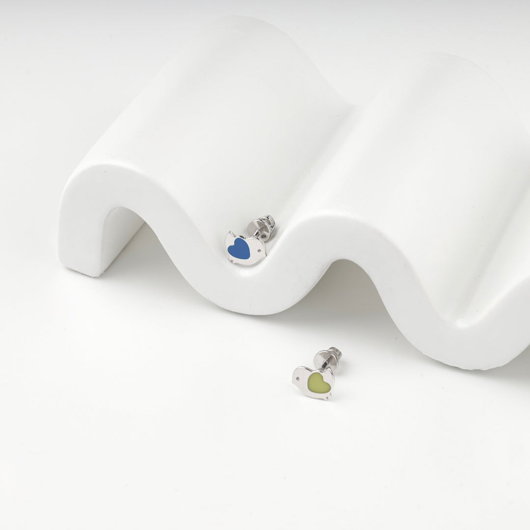 Blue enamel bird stud on the display and the yellow enamel stud below it