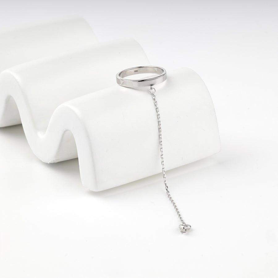 Sterling silver 925 ring with a fine chain hanging from the band