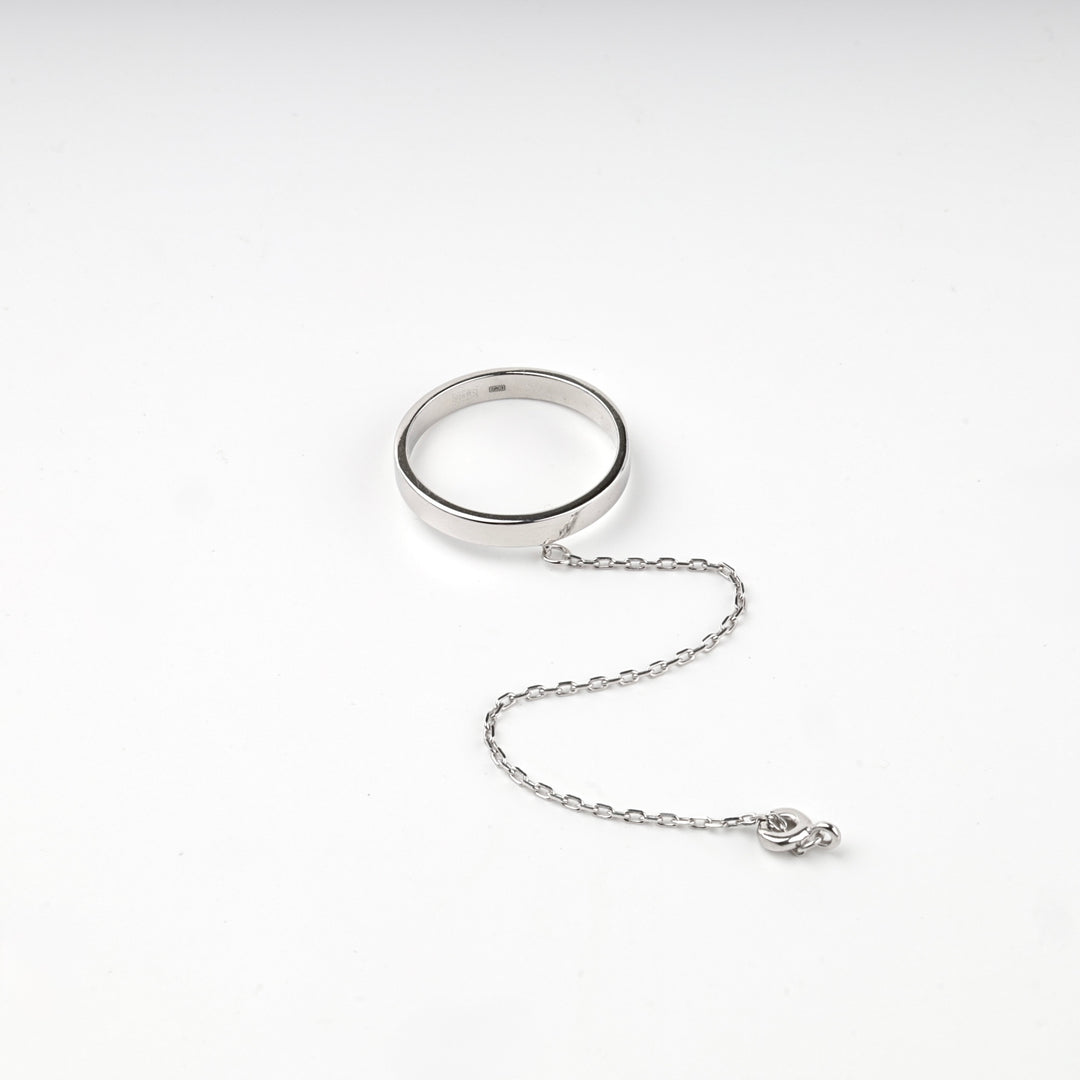 Silver 925 ring with chain and spring ring clasp on a white background