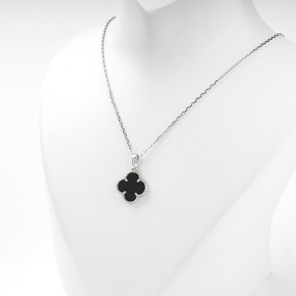 Silver 925 black onyx clover pendant necklace on a display bust, angled view