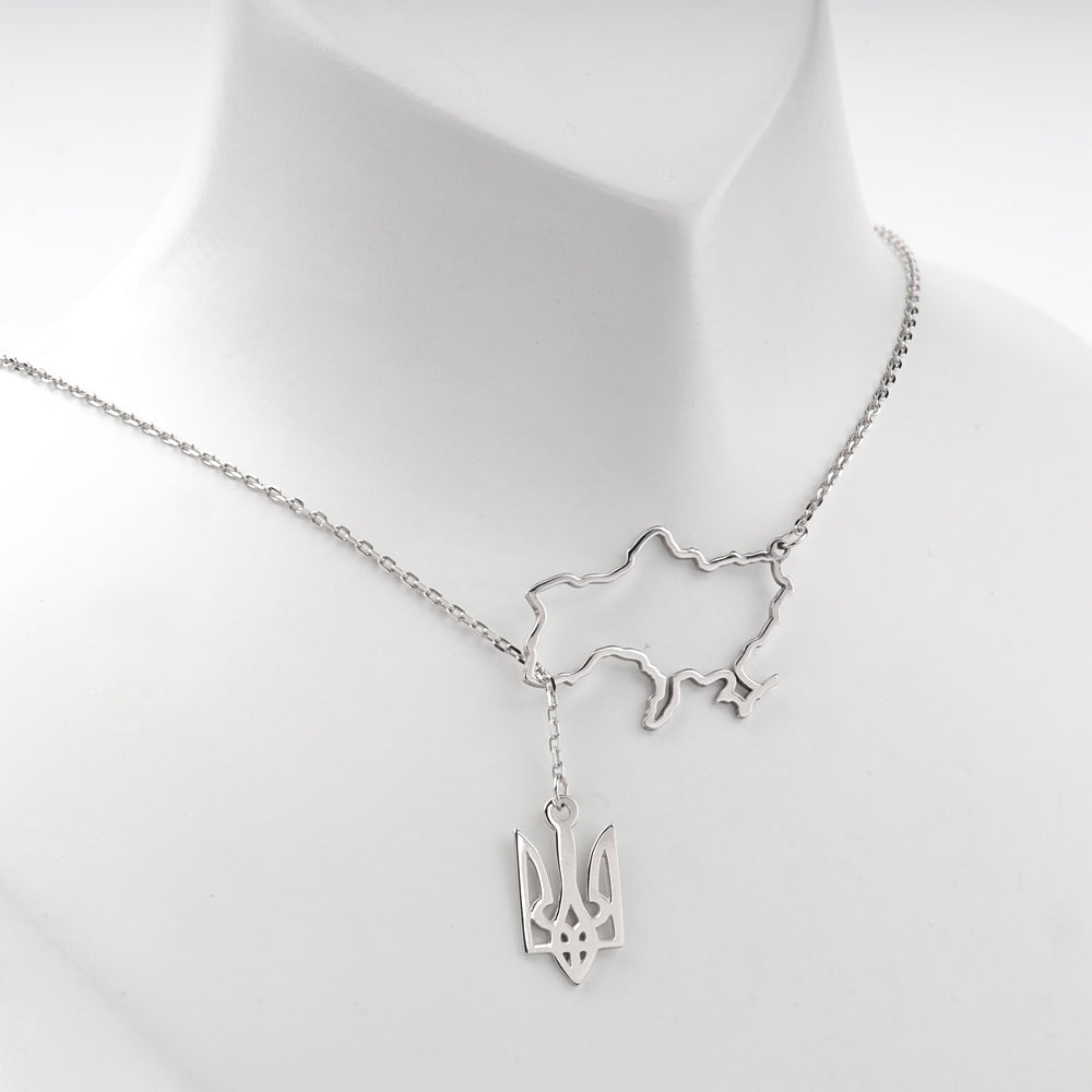 Close view of the openwork map of Ukraine and the trident pendant