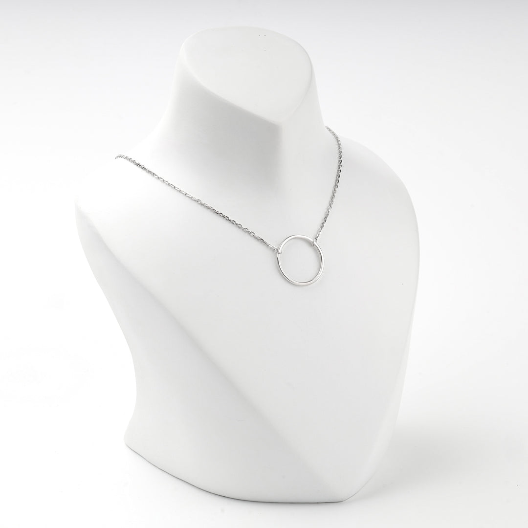 Angled view of the open circle necklace on a white bust